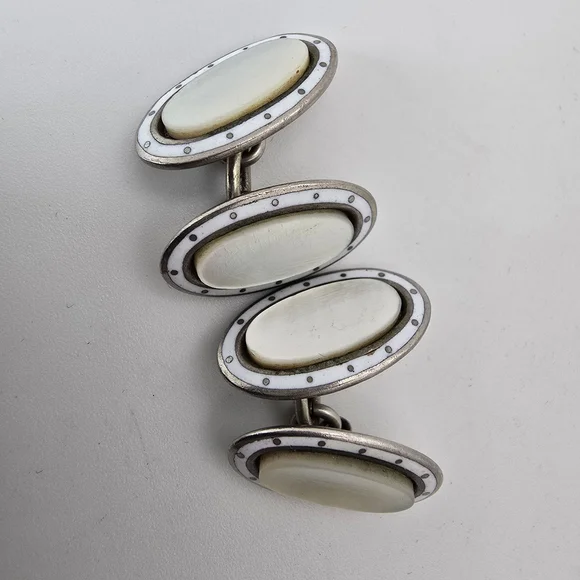 1920s antiqie mother of pearl and white enamel cufflinks.